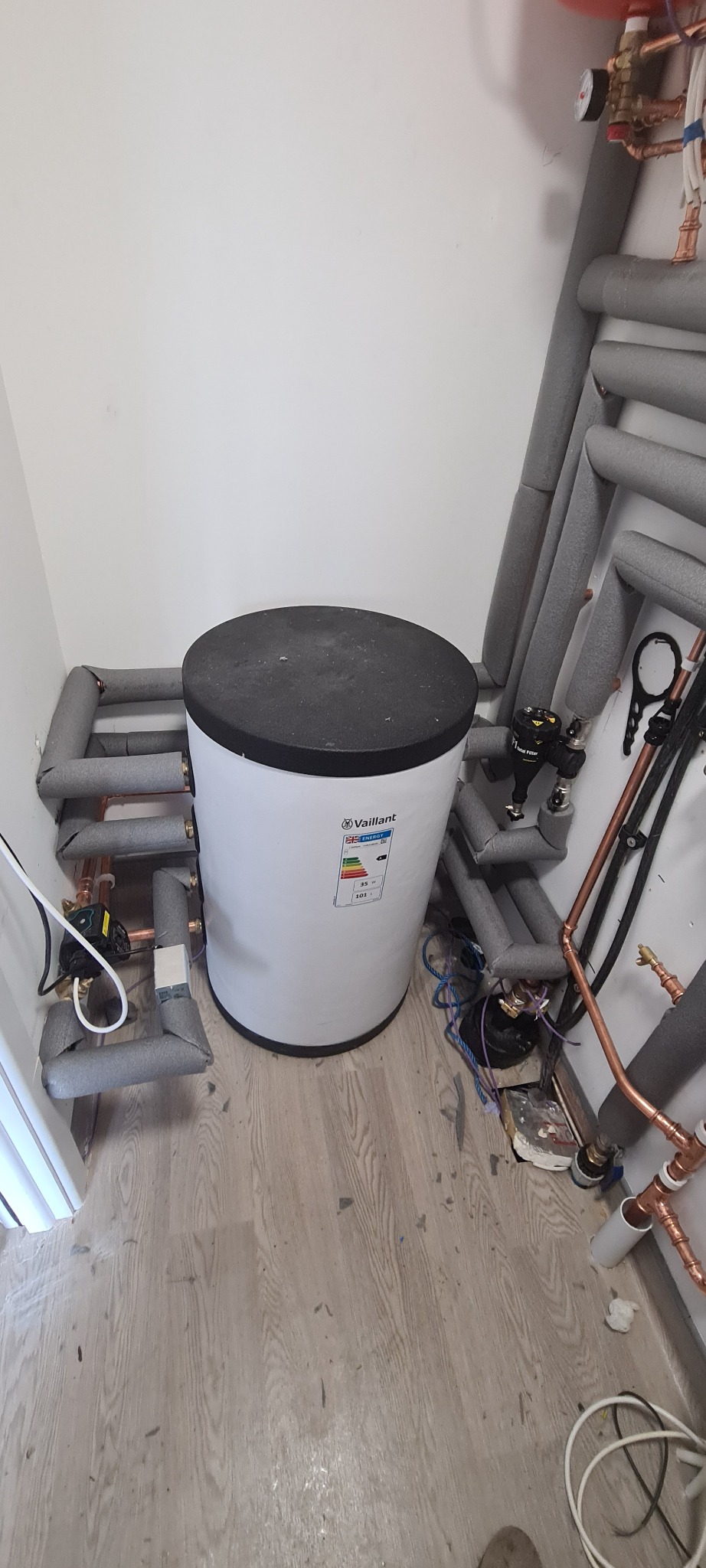 Hot water cylinder installation in utility room