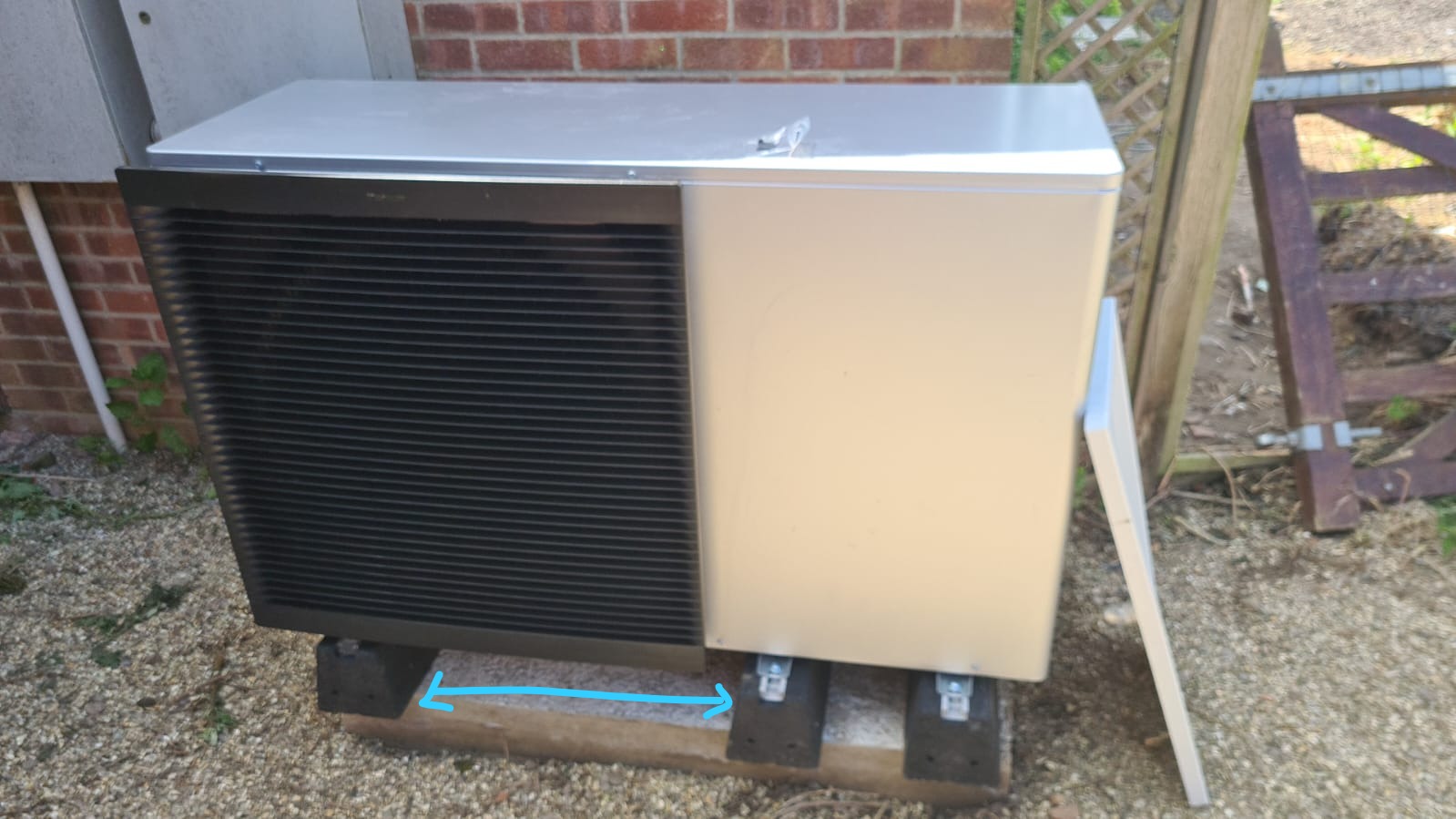 Air source heat pump installation outside a building